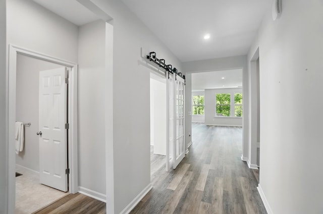 8042 Arcadia Blvd, Alexandria, KY 41001 - hallway featuring a barn door, wood finished floors, baseboards, and recessed lighting