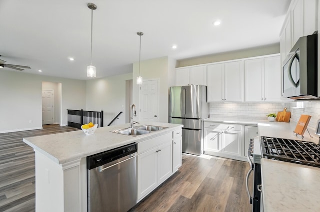 8042 Arcadia Blvd, Alexandria, KY 41001 - kitchen featuring appliances with stainless steel finishes, a sink, dark wood-type flooring, backsplash, and decorative light fixtures