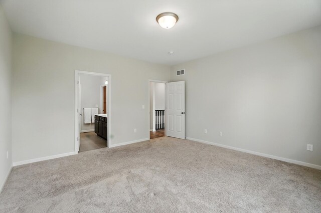 8042 Arcadia Blvd, Alexandria, KY 41001 - unfurnished bedroom featuring carpet, baseboards, and connected bathroom