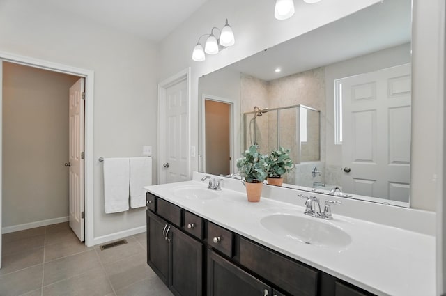 8042 Arcadia Blvd, Alexandria, KY 41001 - bathroom featuring a stall shower, baseboards, tile patterned floors, and double vanity