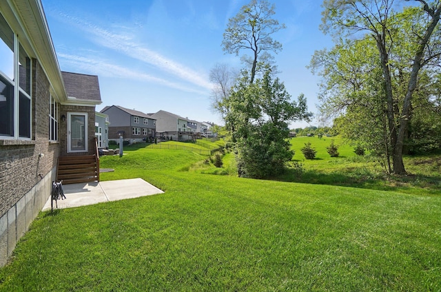 8042 Arcadia Blvd, Alexandria, KY 41001 - view of green lawn featuring a residential view and a patio area