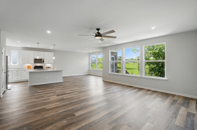 8042 Arcadia Blvd, Alexandria, KY 41001 - unfurnished living room featuring healthy amount of natural light, a ceiling fan, recessed lighting, dark wood-type flooring, and baseboards