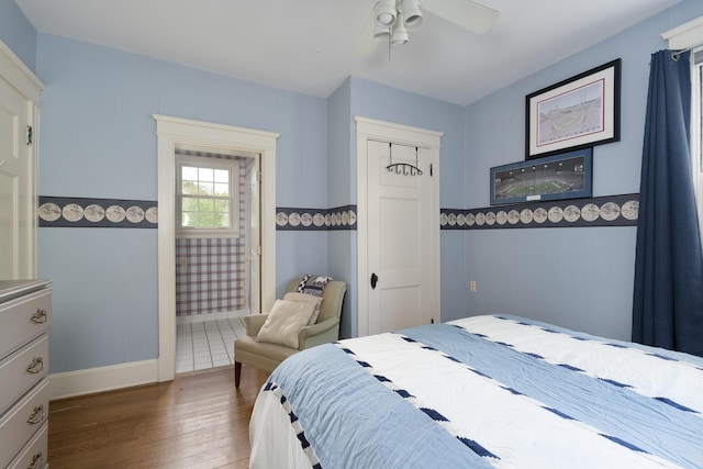 69 Linden Ave, Fort Thomas, KY 41075 - bedroom featuring wood finished floors, a ceiling fan, a closet, baseboards, and ensuite bathroom