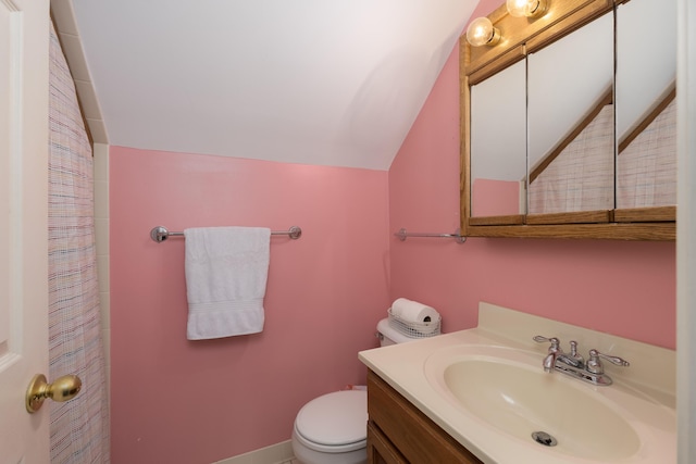 69 Linden Ave, Fort Thomas, KY 41075 - bathroom with vaulted ceiling, toilet, vanity, and a shower with shower curtain