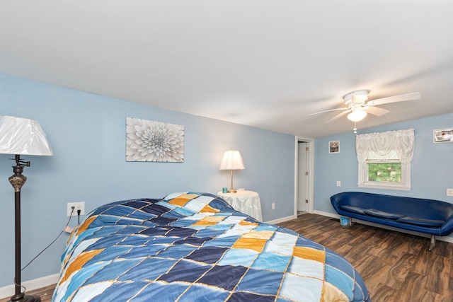 bedroom with wood finished floors, baseboards, and a ceiling fan