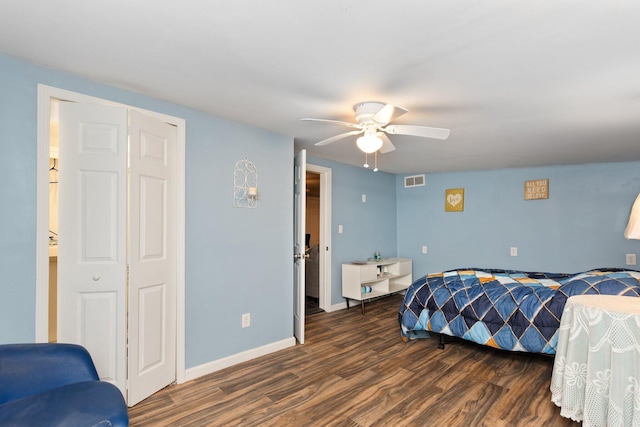 bedroom featuring wood finished floors, a ceiling fan, and baseboards