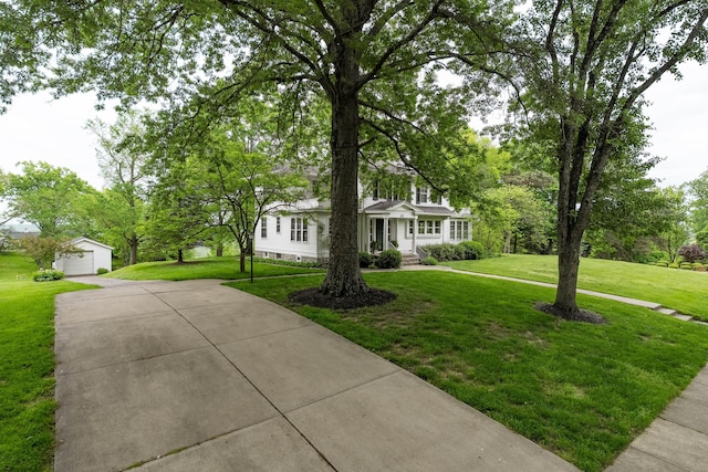 32 S Shaw Ln, Fort Thomas, KY 41075 - view of front of house with an outdoor structure, a front lawn, and a detached garage