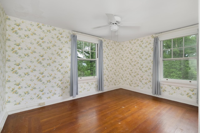 32 S Shaw Ln, Fort Thomas, KY 41075 - spare room featuring wood finished floors, wallpapered walls, baseboards, and a ceiling fan