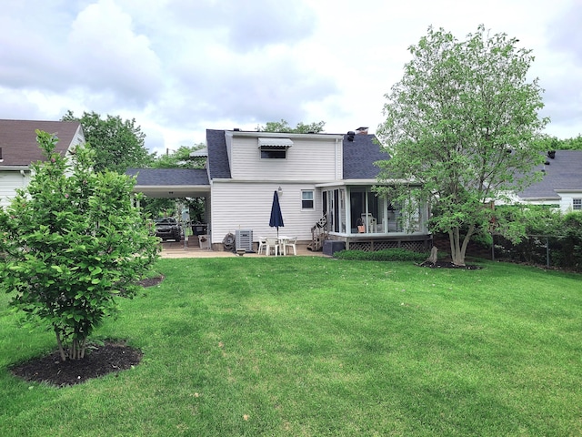 107 Timberlake Ave, Erlanger, KY 41018 - back of house with roof with shingles, a carport, a sunroom, a yard, and a patio area