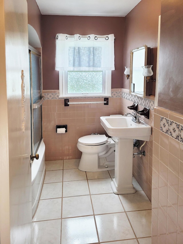 107 Timberlake Ave, Erlanger, KY 41018 - full bathroom with tile walls, tile patterned flooring, healthy amount of natural light, a wainscoted wall, and toilet