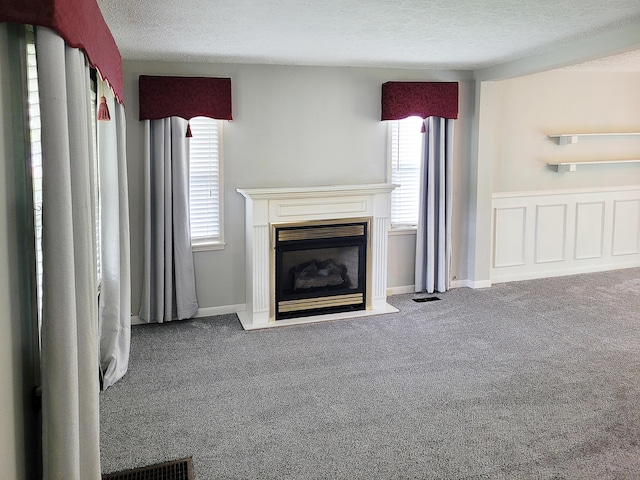 107 Timberlake Ave, Erlanger, KY 41018 - unfurnished living room with carpet, a textured ceiling, and a fireplace