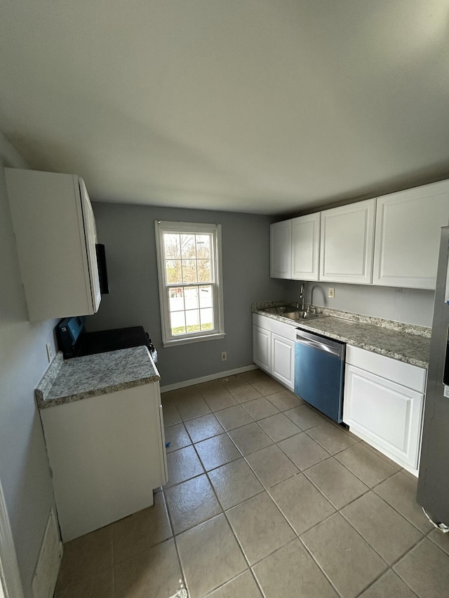 408 Florence Ct, Elsmere, KY 41018 - kitchen featuring stainless steel appliances, light tile patterned floors, white cabinets, baseboards, and a sink