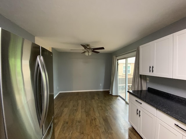 kitchen featuring freestanding refrigerator, ceiling fan, white cabinetry, and dark wood-style floors