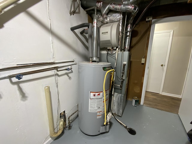 utility room with gas water heater