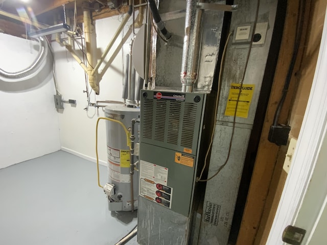 utility room featuring water heater and heating unit