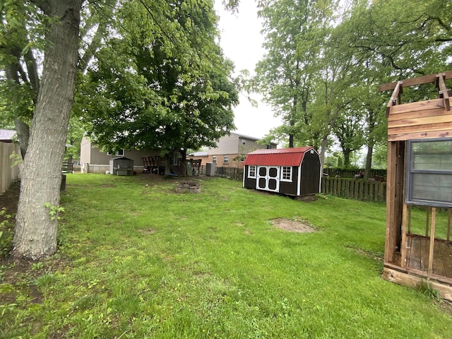 view of yard with a shed and an outbuilding