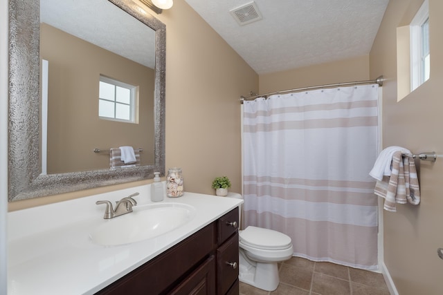 bathroom with toilet, tile patterned flooring, vanity, a textured ceiling, and a shower with shower curtain