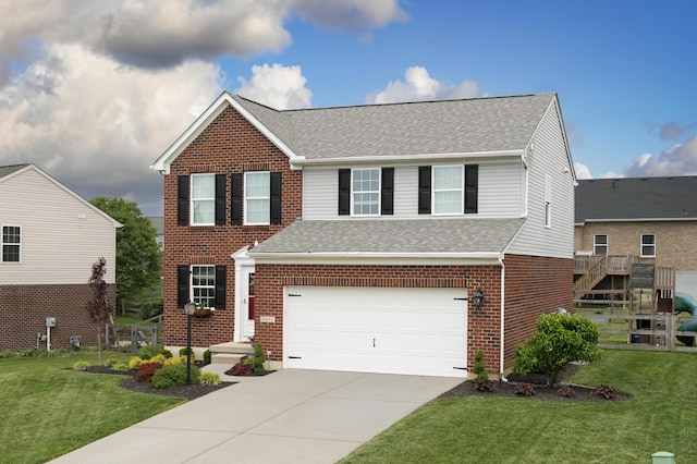 traditional-style house with roof with shingles, driveway, a front yard, and brick siding