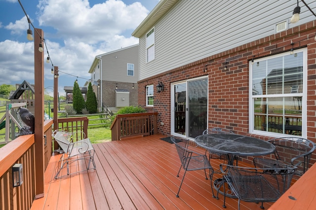 wooden deck with outdoor dining space