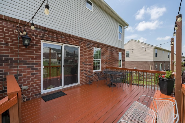 wooden deck featuring outdoor dining space