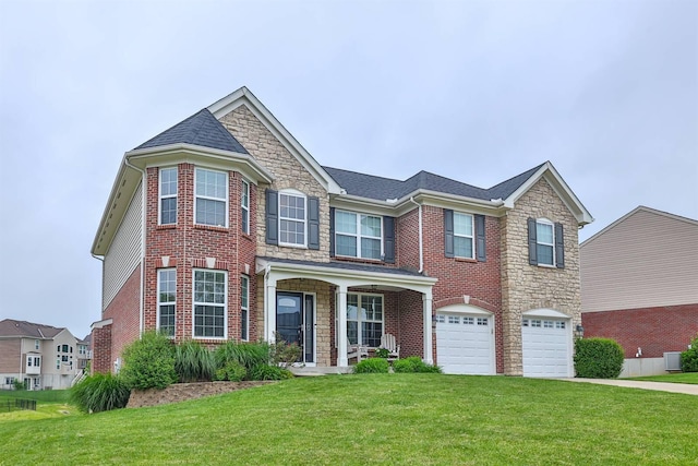2011 Holderness Dr, Union, KY 41091 - view of front of property with an attached garage, a front lawn, stone siding, concrete driveway, and brick siding