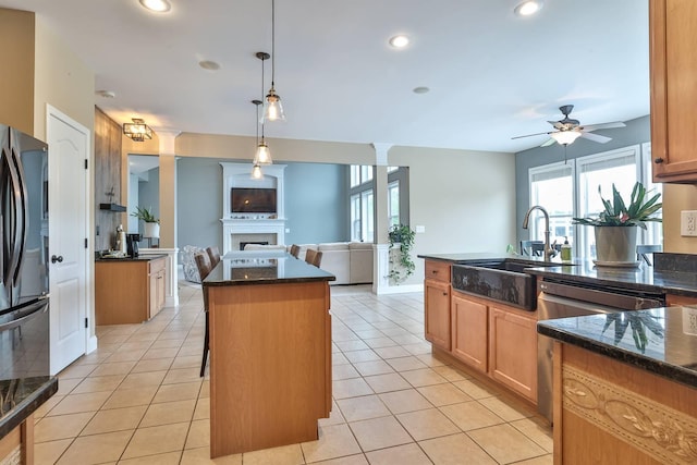 2011 Holderness Dr, Union, KY 41091 - kitchen with freestanding refrigerator, a fireplace, open floor plan, a sink, and ceiling fan