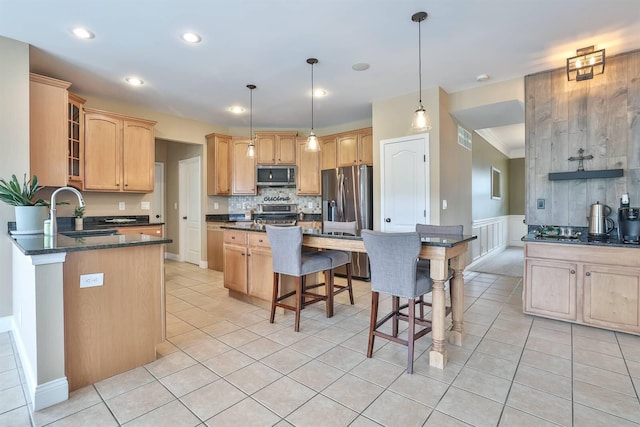 2011 Holderness Dr, Union, KY 41091 - kitchen with appliances with stainless steel finishes, a sink, a breakfast bar area, glass insert cabinets, and light tile patterned floors