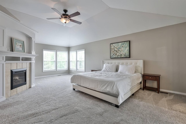 2011 Holderness Dr, Union, KY 41091 - bedroom featuring light colored carpet, vaulted ceiling, baseboards, a tile fireplace, and a ceiling fan