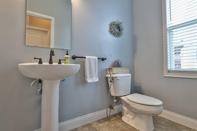 2011 Holderness Dr, Union, KY 41091 - bathroom with baseboards, toilet, and tile patterned flooring