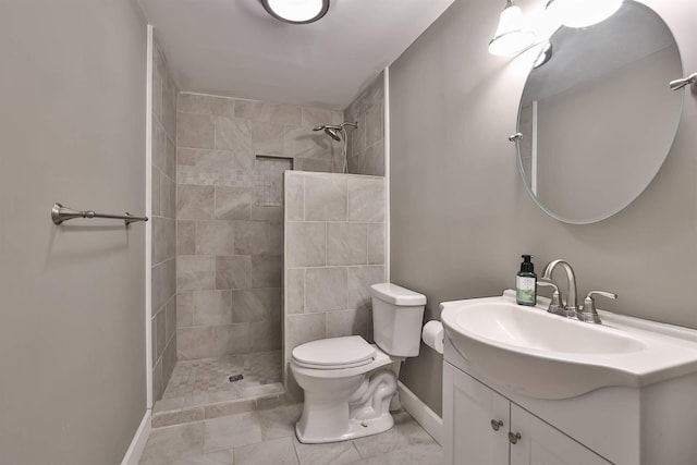 2011 Holderness Dr, Union, KY 41091 - bathroom featuring tiled shower, baseboards, toilet, and vanity