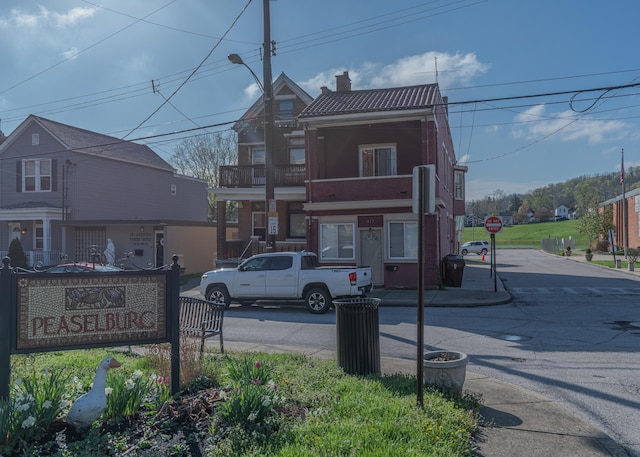 417 W 19th St, Covington, KY 41014 - view of asphalt street featuring traffic signs, curbs, and street lights