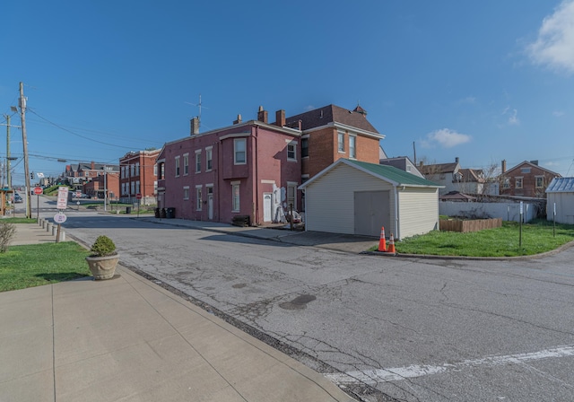 417 W 19th St, Covington, KY 41014 - view of asphalt street featuring curbs, a residential view, sidewalks, and traffic signs