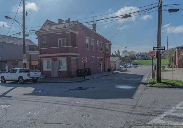 417 W 19th St, Covington, KY 41014 - view of asphalt street with traffic signs, curbs, sidewalks, and street lighting