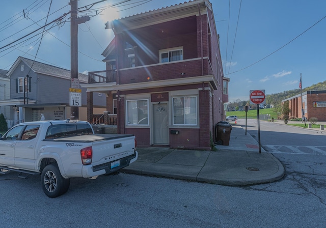 417 W 19th St, Covington, KY 41014 - view of property featuring brick siding and a balcony