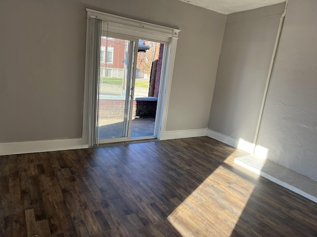 417 W 19th St, Covington, KY 41014 - empty room with dark wood-style floors and baseboards
