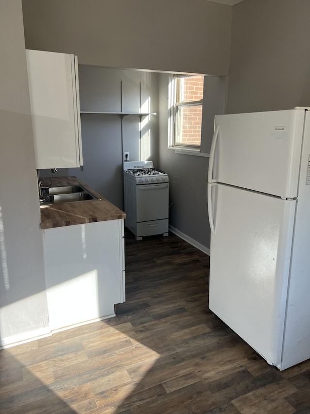 417 W 19th St, Covington, KY 41014 - kitchen with white appliances, a sink, wooden counters, and dark wood finished floors