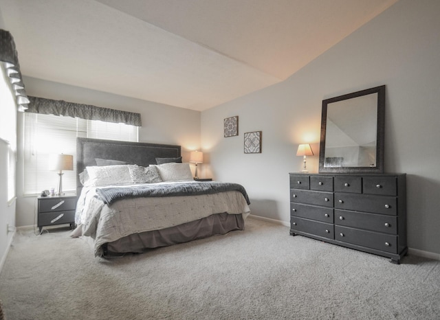 carpeted bedroom featuring baseboards