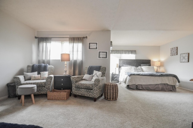 carpeted bedroom featuring baseboards