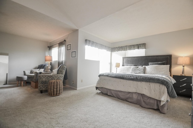 carpeted bedroom with baseboards