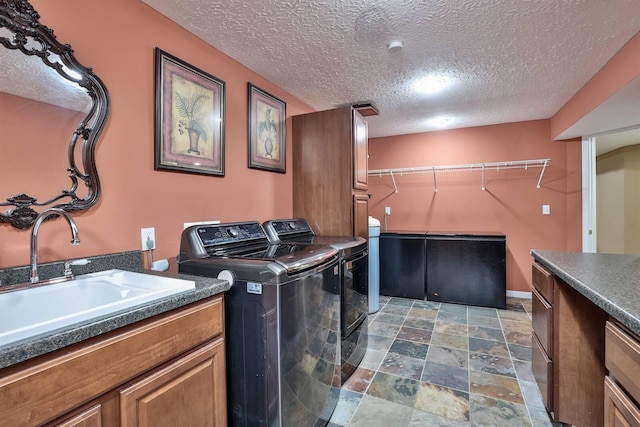 9015 Washington Trace Rd, California, KY 41007 - washroom with washer and dryer, stone finish floors, cabinet space, and a textured ceiling