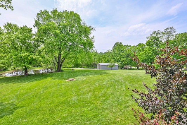 9015 Washington Trace Rd, California, KY 41007 - view of green lawn featuring a water view, view of golf course, an outdoor structure, and view of wooded area