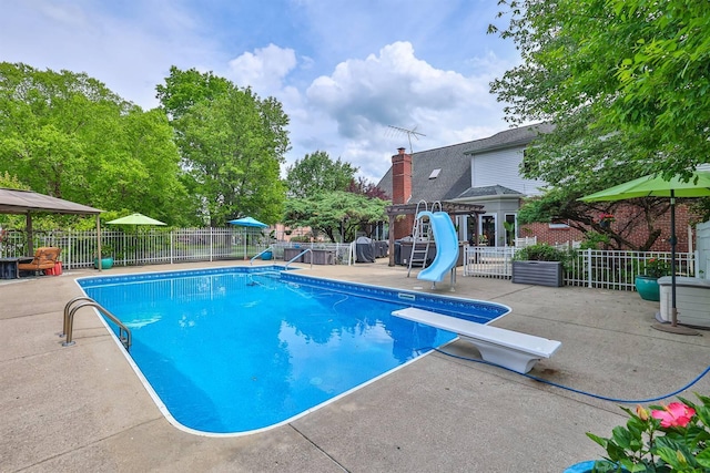9015 Washington Trace Rd, California, KY 41007 - view of swimming pool with a patio, a water slide, a diving board, and a gazebo