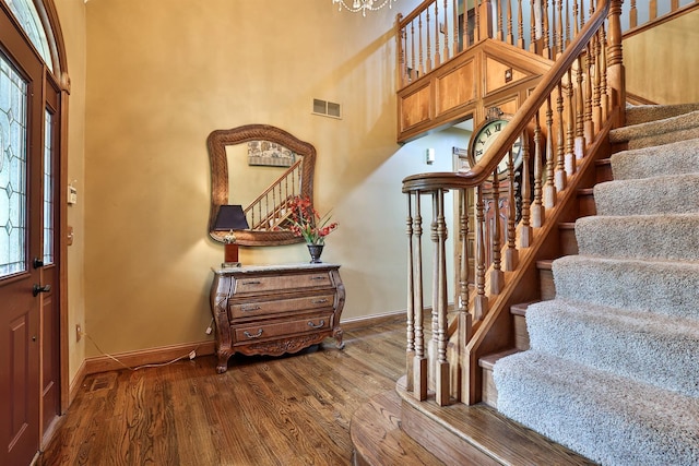 9015 Washington Trace Rd, California, KY 41007 - foyer with stairway, dark wood-style flooring, healthy amount of natural light, a high ceiling, and a chandelier