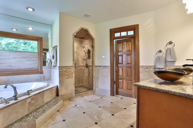 9015 Washington Trace Rd, California, KY 41007 - full bathroom with tile walls, a garden tub, a stall shower, tile patterned floors, and vanity