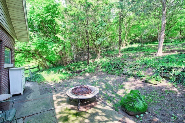 view of patio featuring a fire pit