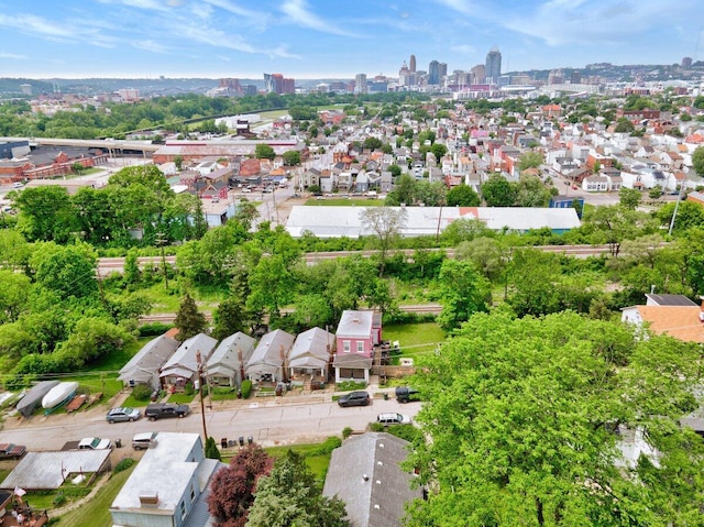 aerial view of property's location featuring a skyline view