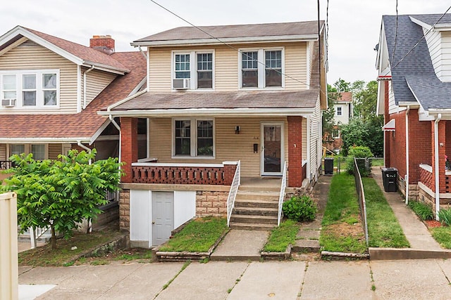 view of front facade featuring covered porch, cooling unit, fence, and a shingled roof