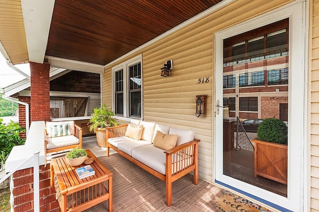 deck with a porch and an outdoor living space