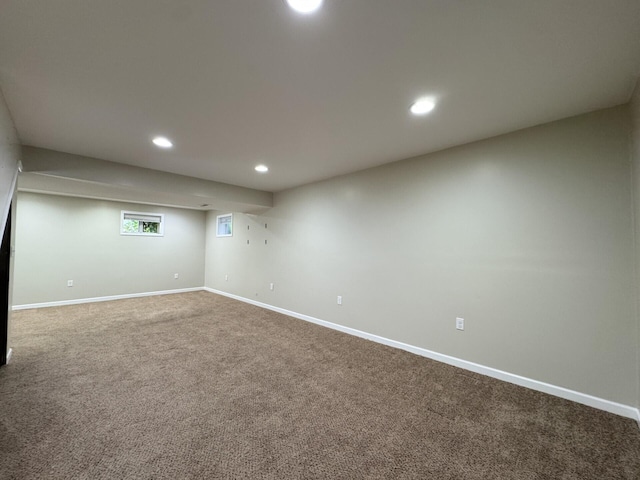 below grade area featuring recessed lighting, carpet flooring, and baseboards