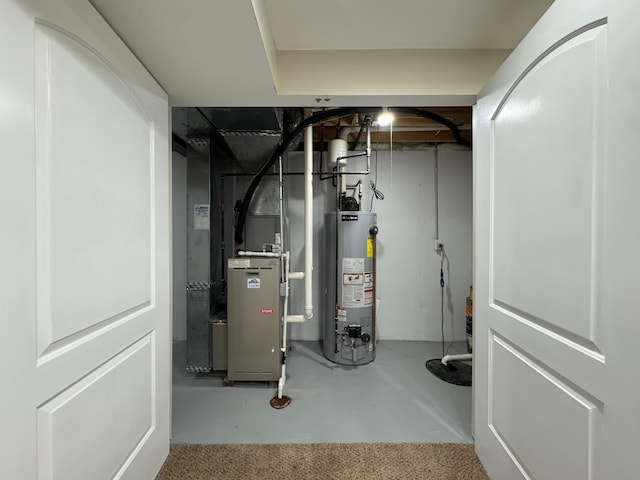 utility room with water heater and heating unit